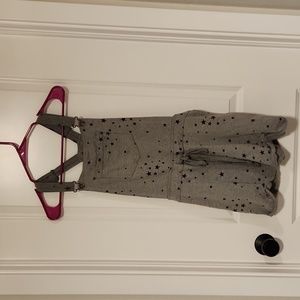 Grey sweatshirt material overalls with black stars